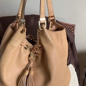 Tan handbag gently used well taken care dust bag